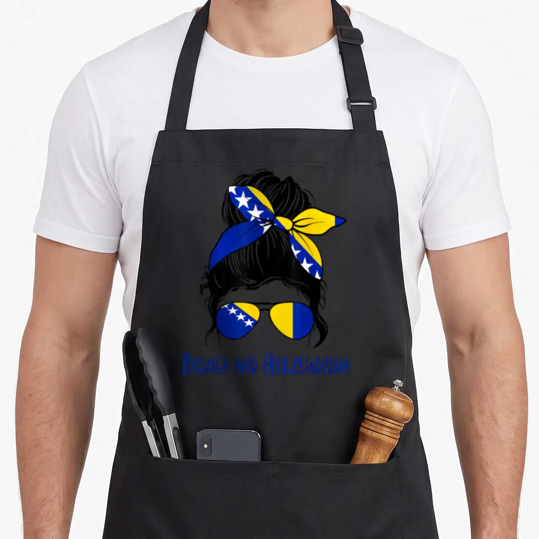Bosniak bosnian apron - Stylized woman head with flag sunglasses and Bosnia and Herzegovina text in blue yellow black — shown on a black cotton canvas apron against a white background