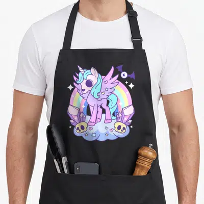 Pony goth apron - Purple alicorn on cloud with rainbow, skulls, crystals, and bat in cartoon style — shown on a black cotton canvas apron against a white background