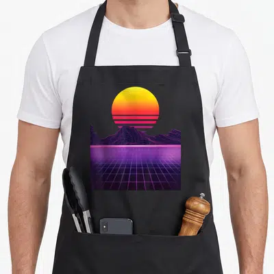 Outrun 80s apron - Yellow pink gradient sun above purple wireframe mountains and perspective grid — shown on a black cotton canvas apron against a white background