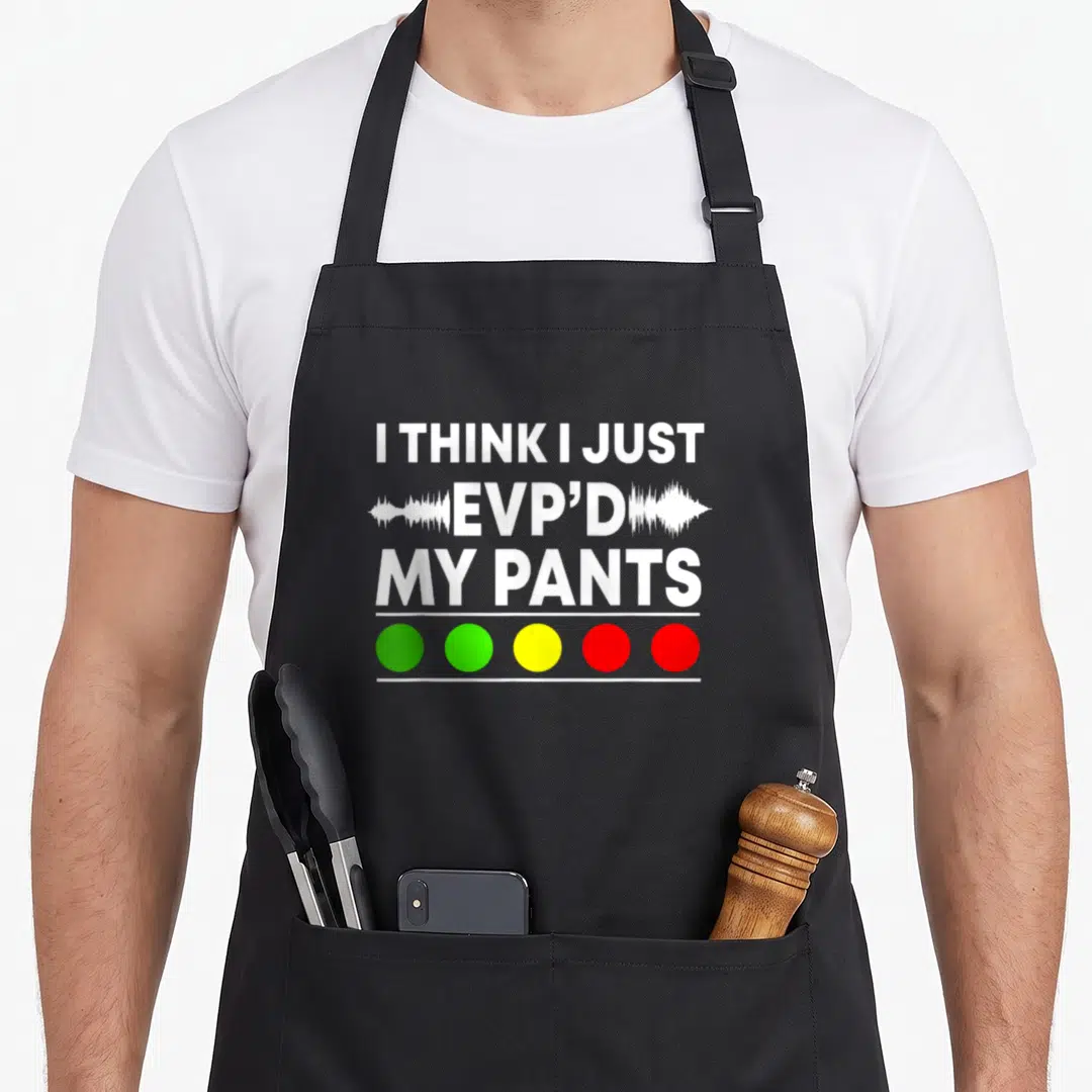 Hunting halloween apron - White text I THINK I JUST EVP'D MY PANTS with soundwave and five colored circles — shown on a black cotton canvas apron against a white background