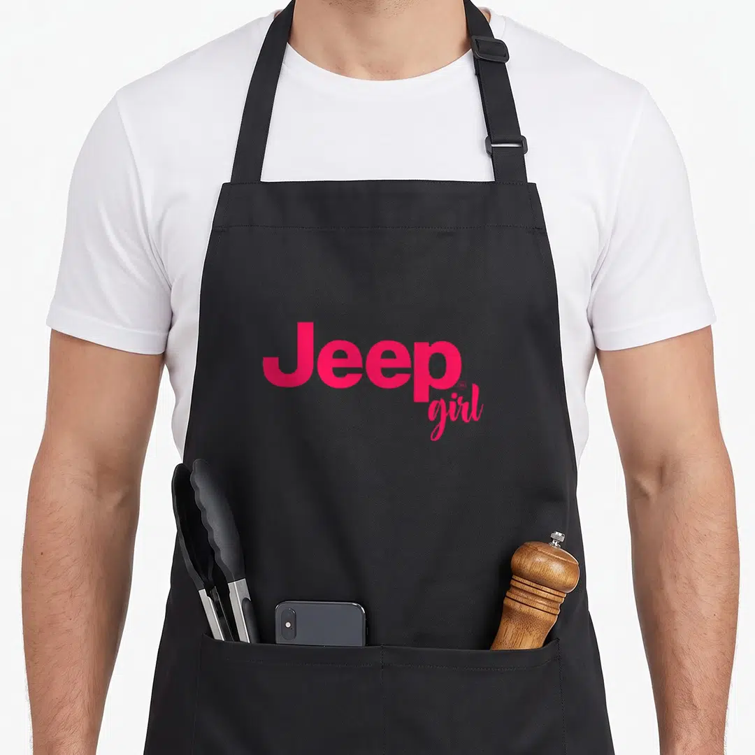Comfort jeep girl apron - Pink text reading Jeep girl in stacked layout on black background — shown on a black cotton canvas apron against a white background