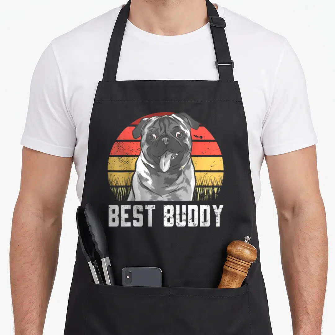 Pug top dog aprons - Retro pug illustration with striped sun and best buddy text — shown on a black cotton canvas apron against a white background