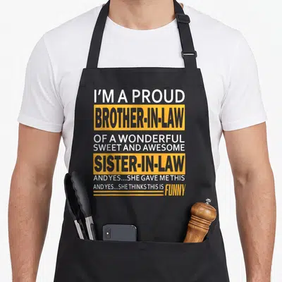 Brother father day apron - Stacked white and grey text inside yellow blocks reading I'm a proud brother-in-law — shown on a black cotton canvas apron against a white background