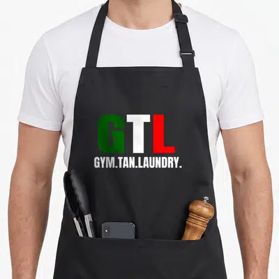 Gym italian flag apron - GTL text in green white and red above GYM.TAN.LAUNDRY label — shown on a black cotton canvas apron against a white background