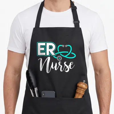 Birthday nurse apron - ER Nurse text with cyan stethoscope heart and white script lettering — shown on a black cotton canvas apron against a white background