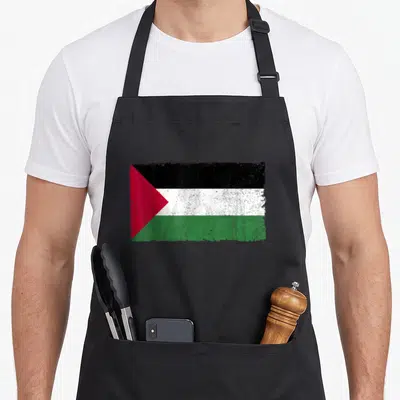 Proud palestinian apron - Distressed rectangular flag with black white green red stripes and red triangle on left side — shown on a black cotton canvas apron against a white background
