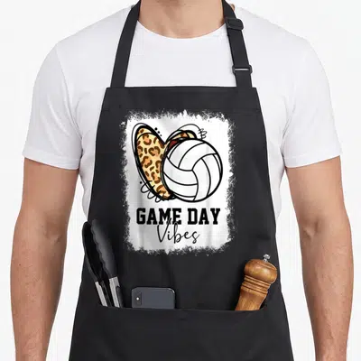 Bleached game aprons - Volleyball overlapping leopard heart with GAME DAY Vibes text in distressed frame — shown on a black cotton canvas apron against a white background