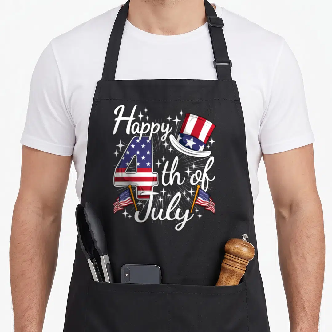 Cute patriotic 4th of july apron - Number 4 filled with red white and blue flag pattern, top hat, and script text — shown on a black cotton canvas apron against a white background