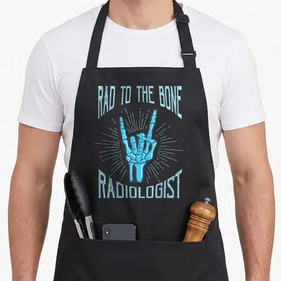 Radiologist radiology apron - Blue skeleton hand rock gesture with rad to the bone text and sunburst lines — shown on a black cotton canvas apron against a white background