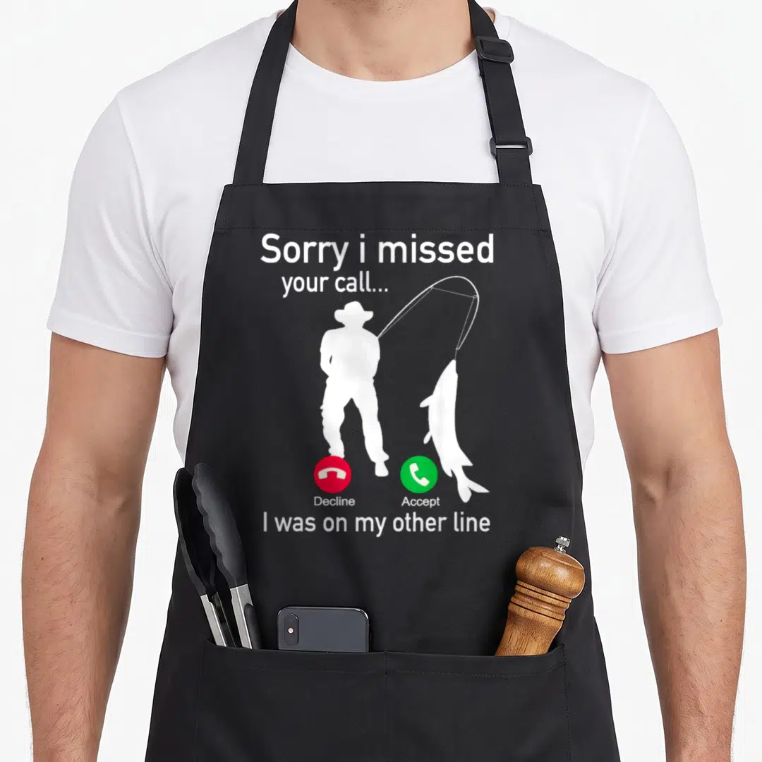 Phone fisherman apron - White fisherman silhouette holding rod with red decline and green accept phone buttons below — shown on a black cotton canvas apron against a white background