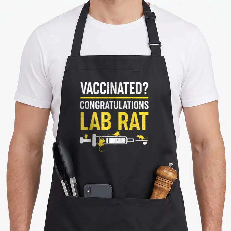 Vaccinated sarcastic apron - White and yellow text reading vaccinated lab rat above a syringe and three yellow rats — shown on a black cotton canvas apron against a white background