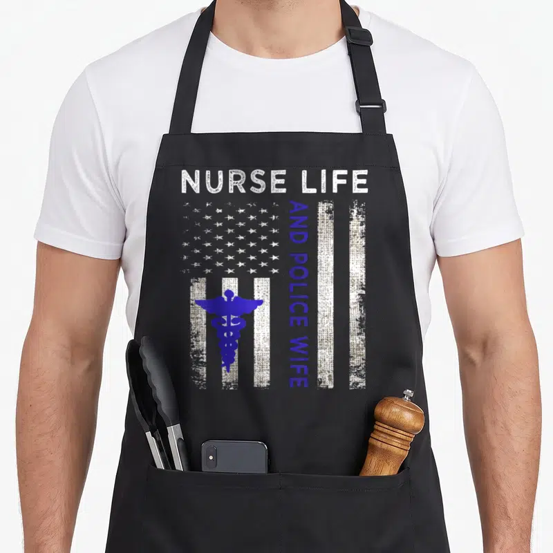 Nurse police american flag apron - Distressed USA flag with blue caduceus and running text reading Nurse Life — shown on a black cotton canvas apron against a white background
