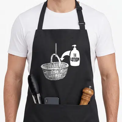 Lotion halloween apron - White line art of lotion bottle and suspended basket with arrow — shown on a black cotton canvas apron against a white background