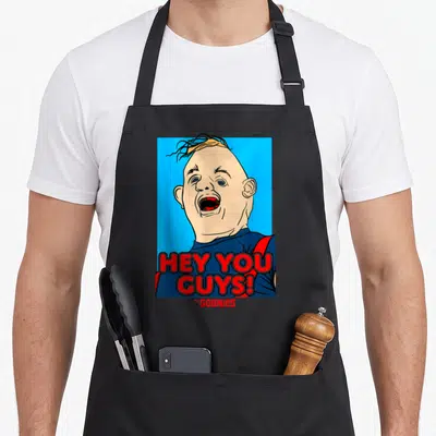Funny hey sloth apron - Cartoon man face with open mouth and red HEY YOU GUYS text on blue background — shown on a black cotton canvas apron against a white background