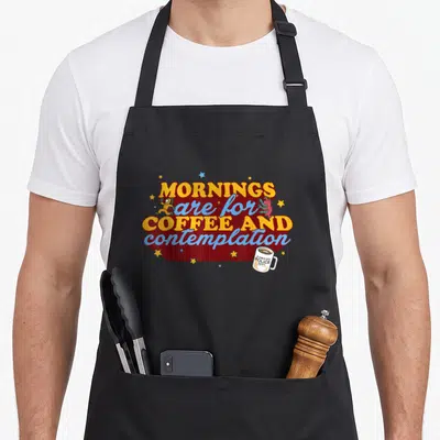 Contemplation coffee apron - Retro text Mornings are for Coffee and Contemplation with Hawkins Police mug and stars — shown on a black cotton canvas apron against a white background