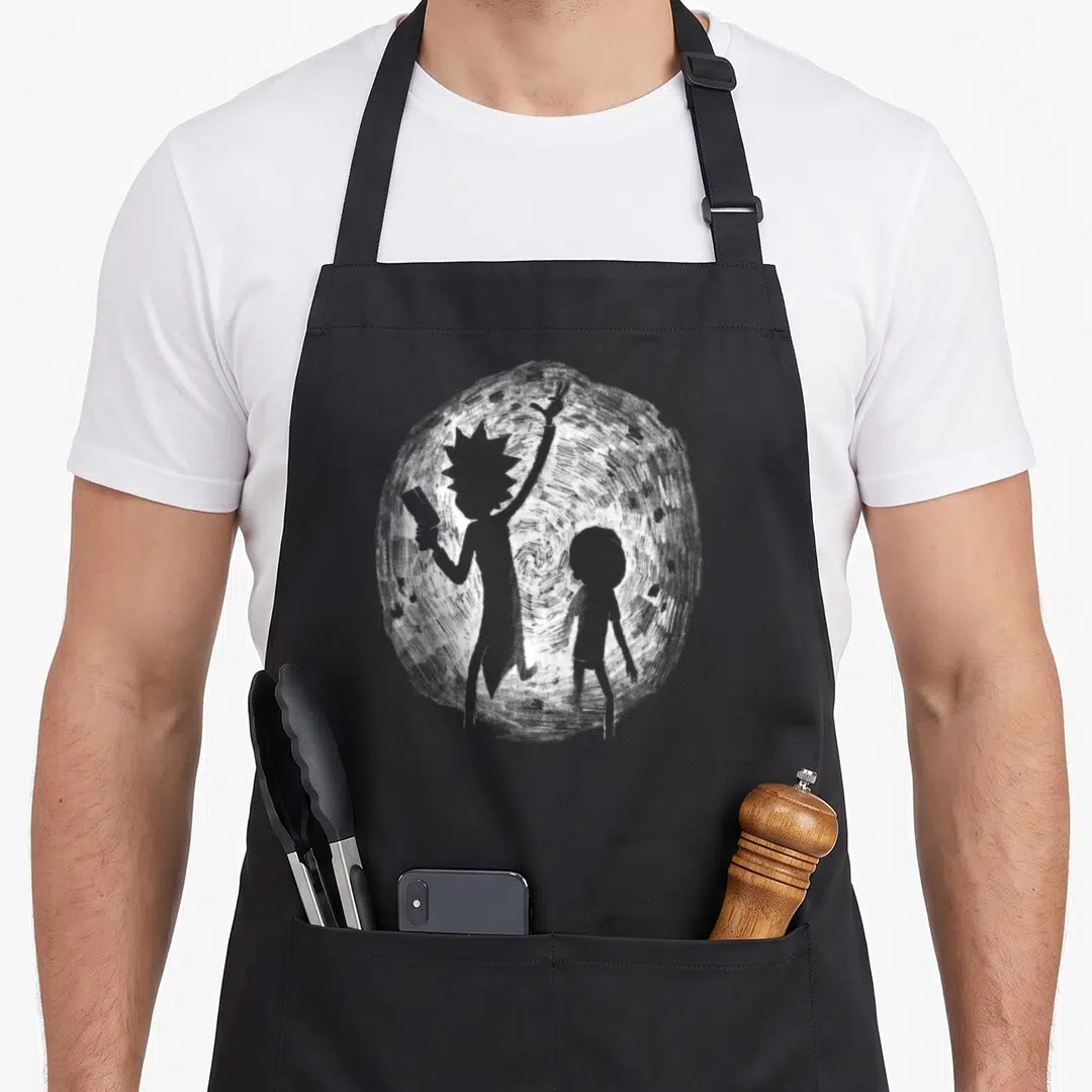 Mademark x apron - Grey silhouettes of two characters standing before a textured white circular portal in line art style — shown on a black cotton canvas apron against a white background