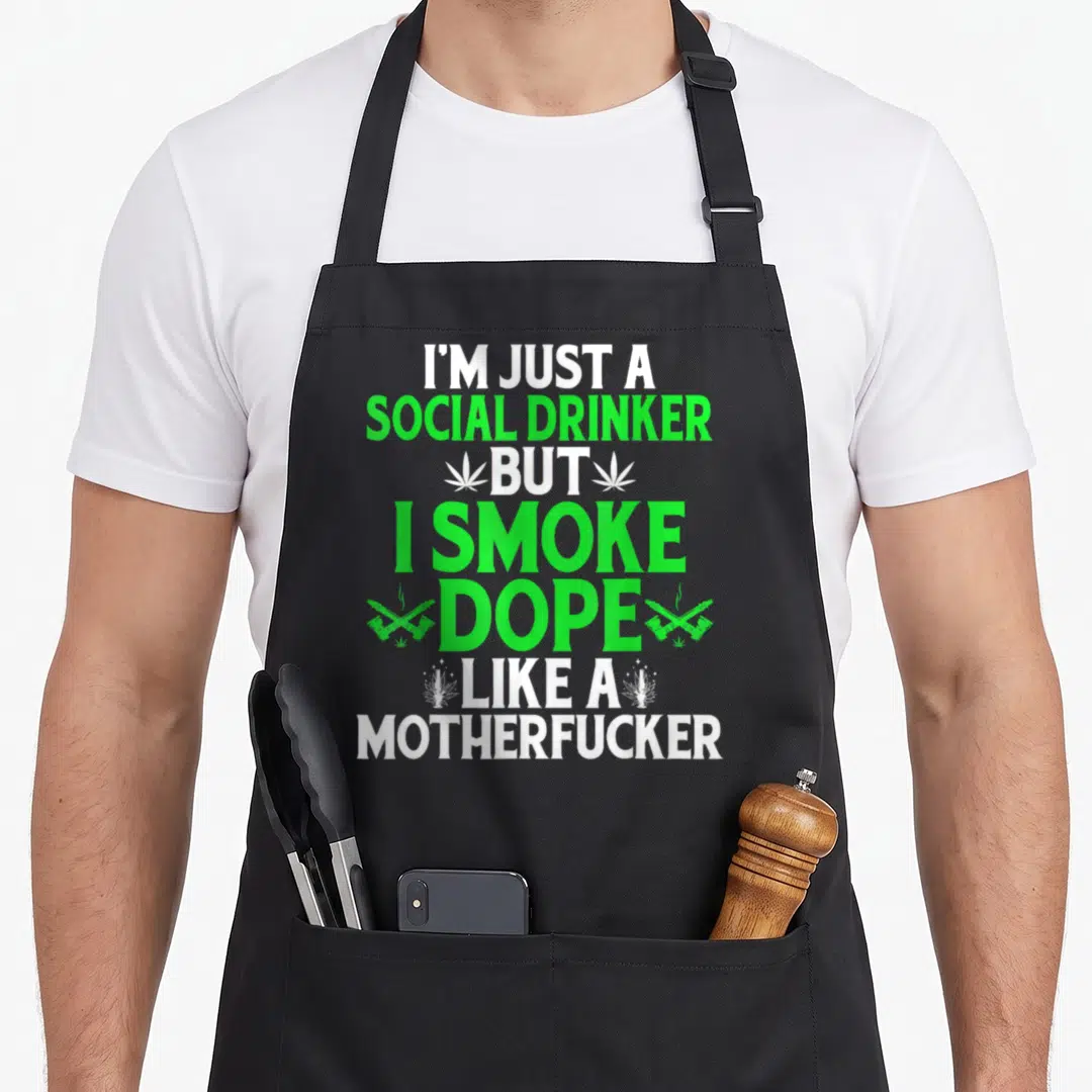 Bong funny pot apron - White and green stacked text with cannabis leaves and crossed rolled items on grey background — shown on a black cotton canvas apron against a white background