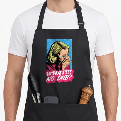 Bass freshwater drum apron - Retro crying woman with yellow hair and pink bubble reading WHAT!!! NO DNB? — shown on a black cotton canvas apron against a white background