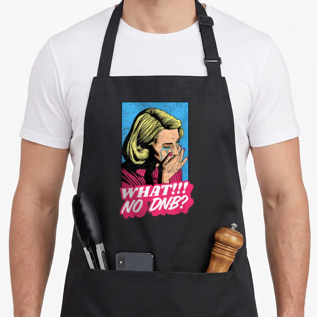 Bass freshwater drum apron - Retro crying woman with yellow hair and pink bubble reading WHAT!!! NO DNB? — shown on a black cotton canvas apron against a white background