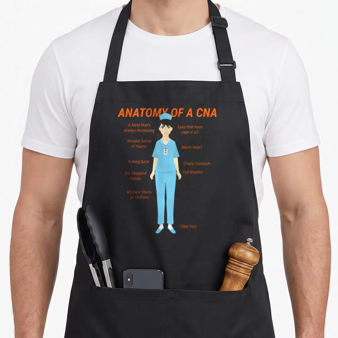 Nurse skirt apron - Cartoon CNA in blue scrubs with orange text labels describing physical symptoms and workplace — shown on a black cotton canvas apron against a white background