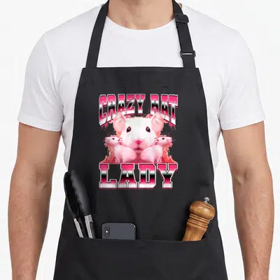 Rat 90s apron - Three white rats between pink CRAZY RAT LADY text on black apron — shown on a black cotton canvas apron against a white background