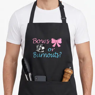 Car bow apron - Pink bow and smoking tire graphic with Bows or Burnouts text — shown on a black cotton canvas apron against a white background