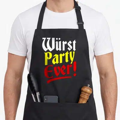 Funny oktoberfest sausage apron - Stacked Wurst Party Ever text in white, yellow, and red gothic fonts with red — shown on a black cotton canvas apron against a white background