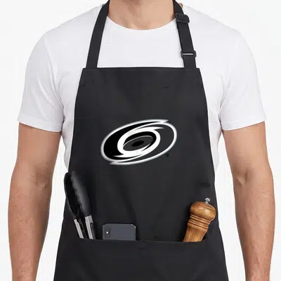 Carolina hurricane apron - Swirl cyclone logo with registered trademark symbol on canvas fabric — shown on a black cotton canvas apron against a white background