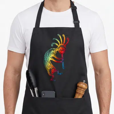 Ornament native american apron - Rainbow gradient kokopelli figure holding staff with swirls and dots in cartoon style — shown on a black cotton canvas apron against a white background