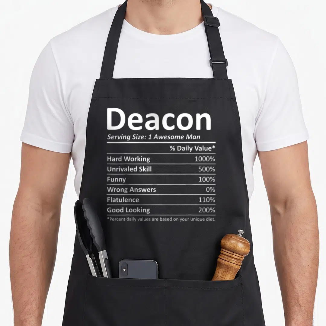 Deacon birthday apron - White nutrition facts label reading Deacon Serving Size 1 Awesome Man with humorous percentage — shown on a black cotton canvas apron against a white background