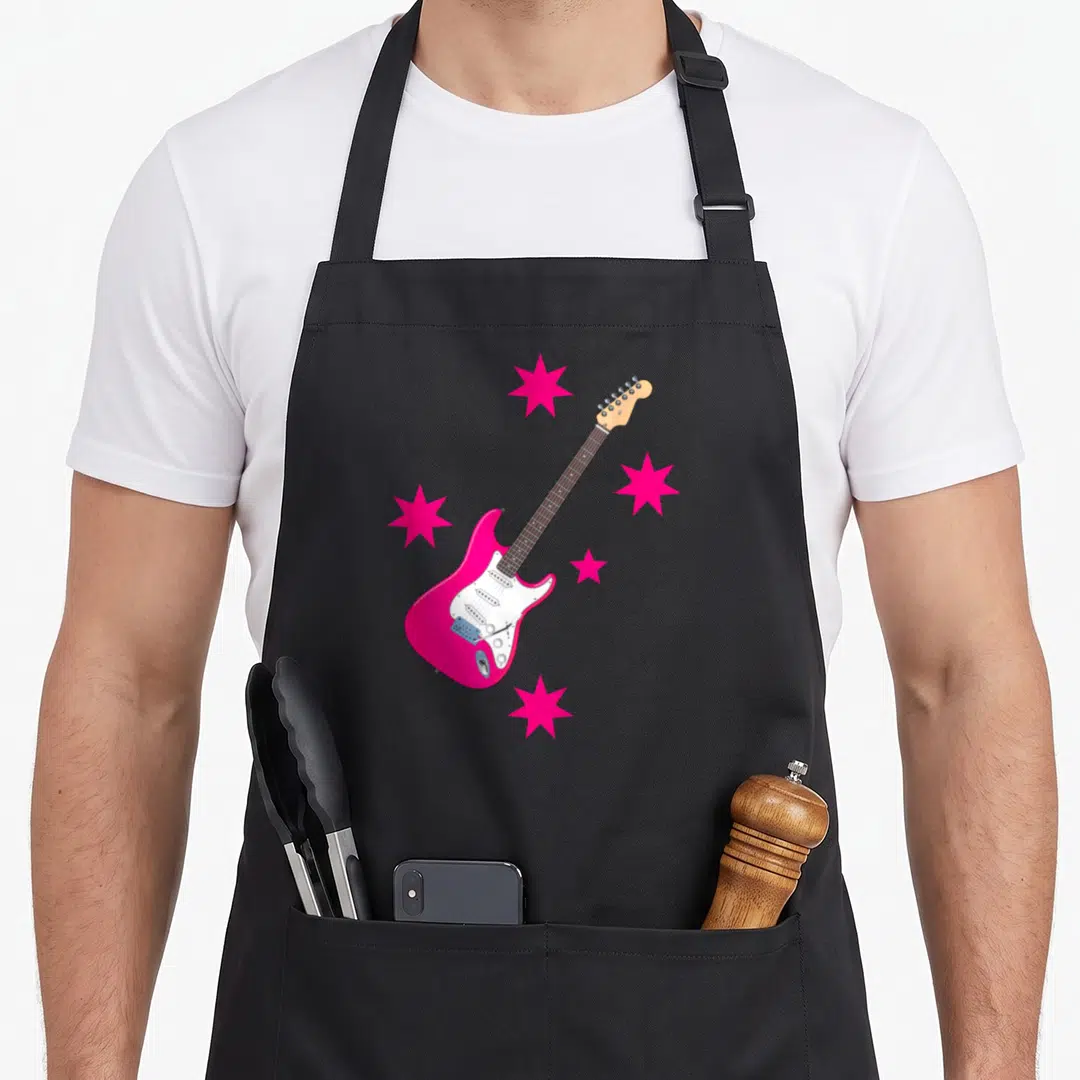 Electric rock concert apron - Pink electric guitar with white pickguard and four pink stars in cartoon style — shown on a black cotton canvas apron against a white background