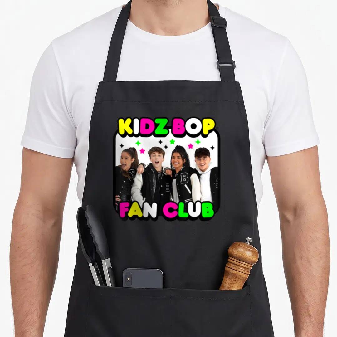 Bop fan club apron - KIDZ BOP FAN CLUB text around photo of four teens with colorful stars — shown on a black cotton canvas apron against a white background