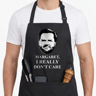Vance president humor apron - Black and white man portrait above text reading MARGARET I REALLY DON'T CARE — shown on a black cotton canvas apron against a white background