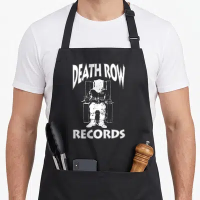 Death not row apron - Distressed white graphic of a seated figure framed by DEATH ROW and RECORDS text — shown on a black cotton canvas apron against a white background