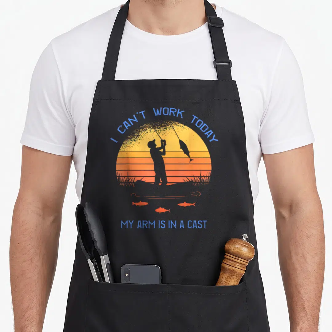 Today fisherman apron - Retro sunset fisherman silhouette with text I Can't Work Today My Arm Is In A Cast and three — shown on a black cotton canvas apron against a white background
