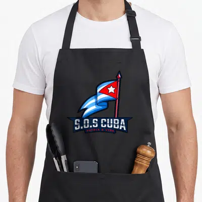 Cubano cuba libre apron - Cartoon Cuban flag on pole above dark banner with S.O.S CUBA PATRIA & VIDA text — shown on a black cotton canvas apron against a white background
