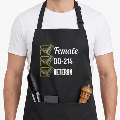 Vintage female veteran apron - Checklist of three olive green boots in yellow frames with white text Female DD-214 — shown on a black cotton canvas apron against a white background