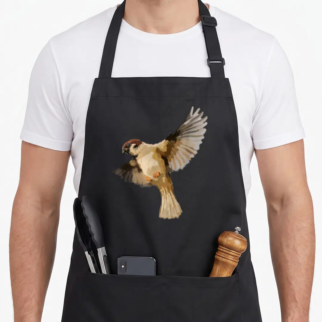 Funny sparrow bird apron - Realistic brown and beige house sparrow flying with spread wings — shown on a black cotton canvas apron against a white background