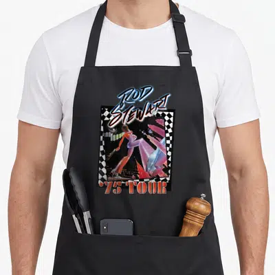 Tour rod apron - Retro 75 TOUR graphic with man in checkered border and blue red pink black white lettering — shown on a black cotton canvas apron against a white background