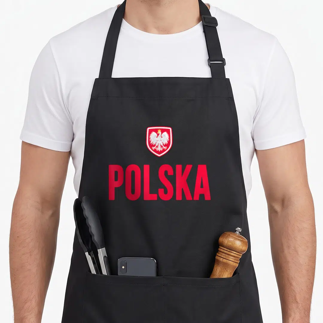Souvenir polish aprons - Red shield with white eagle yellow crown above red POLSKA text — shown on a black cotton canvas apron against a white background