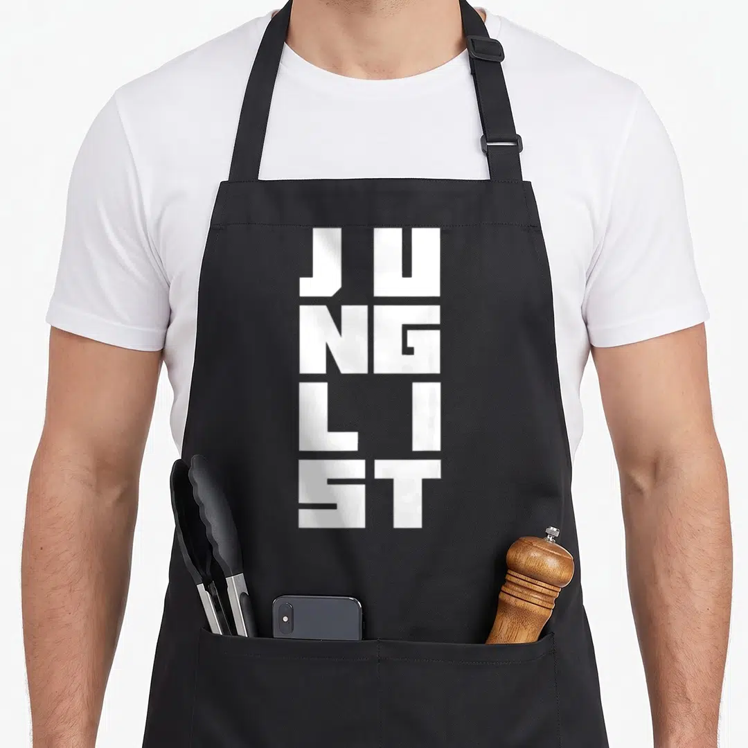 Junglist dubstep apron - White stacked block letters reading JUNG LIST on grey background — shown on a black cotton canvas apron against a white background