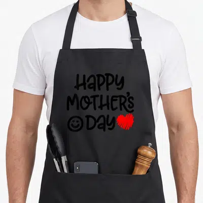 Toddler baby mother's day aprons - Happy Mothers Day text with smiley face and red heart in black and red — shown on a black cotton canvas apron against a white background