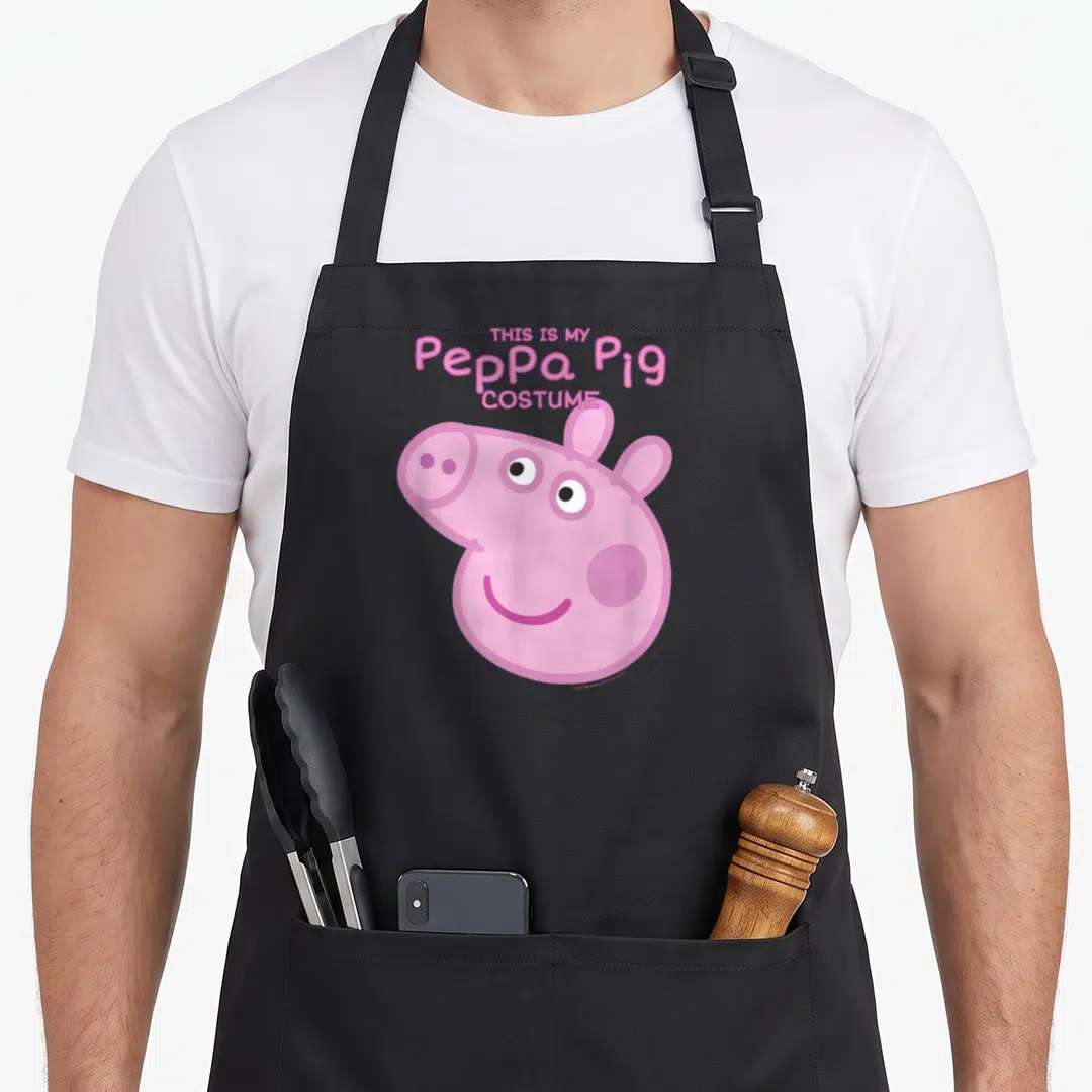Costume halloween apron for cooking - Stacked pink text reading THIS IS MY Peppa Pig COSTUME above a smiling cartoon — shown on a black cotton canvas apron against a white background