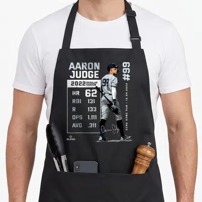 Record new york apron - Aaron Judge 2022 stats graphic with 62 home runs and date 10.04.2022 in white blue grey — shown on a black cotton canvas apron against a white background