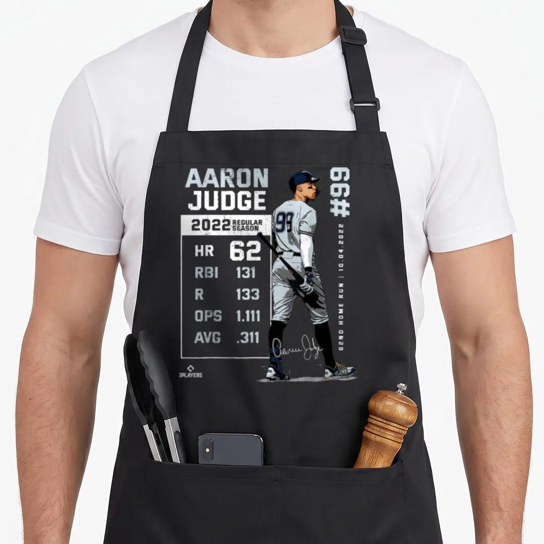 Record new york apron - Aaron Judge 2022 stats graphic with 62 home runs and date 10.04.2022 in white blue grey — shown on a black cotton canvas apron against a white background