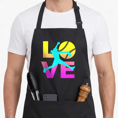 Retro softball apron - Cyan pitcher silhouette overlapping yellow LOVE text and stitched softball — shown on a black cotton canvas apron against a white background
