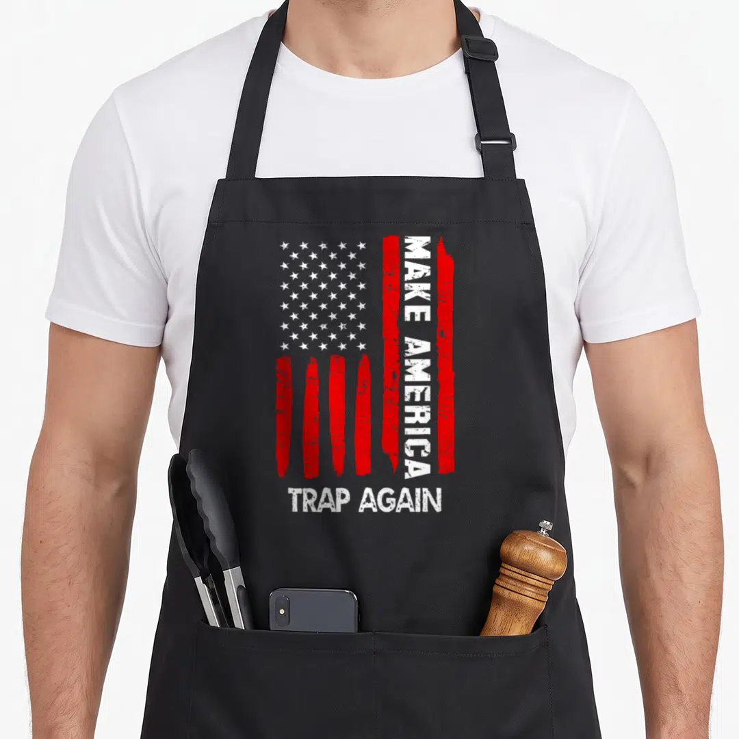 Forth 4th of july apron - Distressed USA flag with vertical Make America Trap Again text in red and white — shown on a black cotton canvas apron against a white background