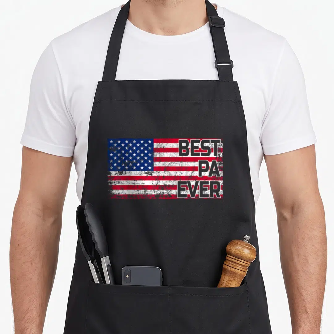 Christmas father day apron - Distressed USA flag with stacked BEST PA EVER text in grey outline — shown on a black cotton canvas apron against a white background