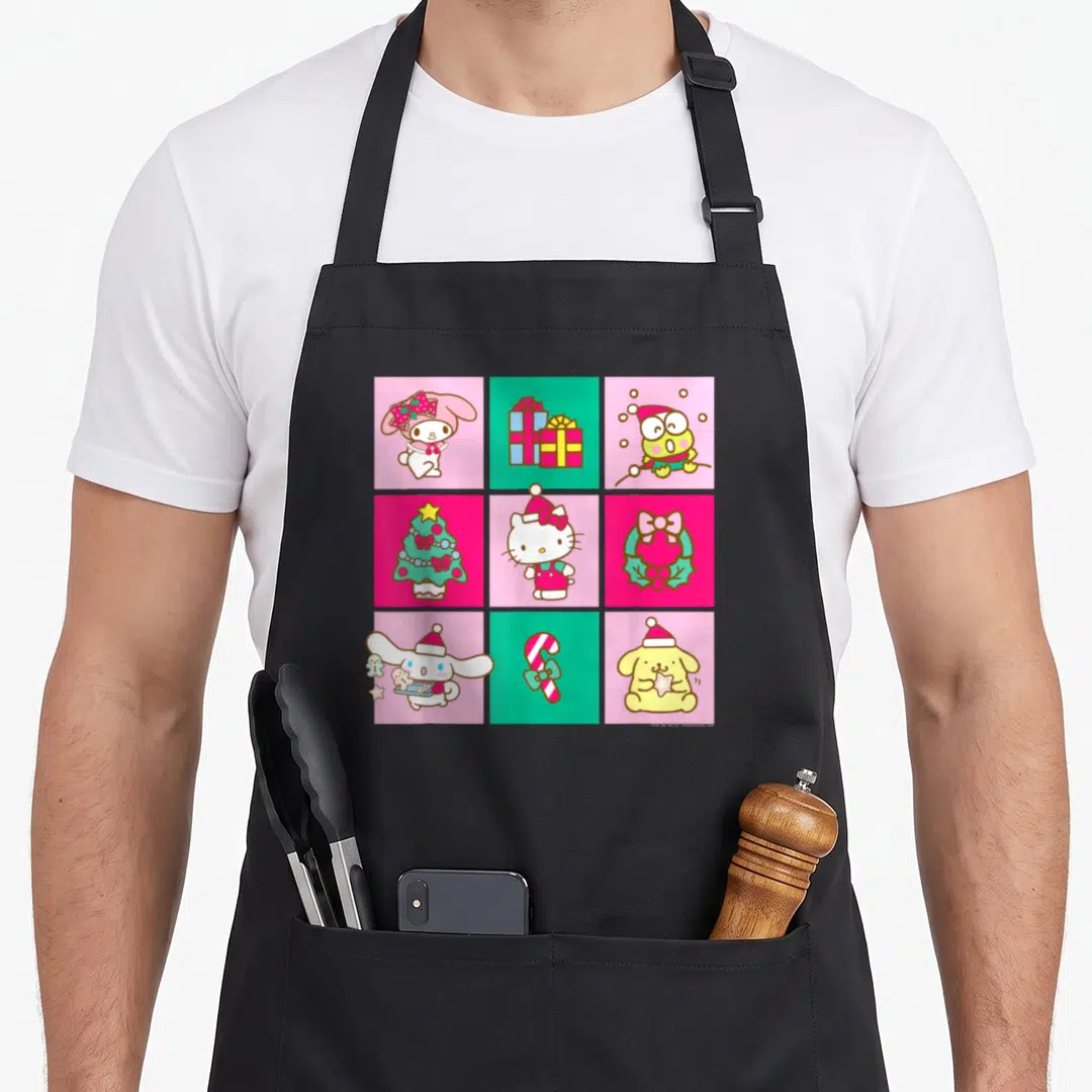 Hello christmas apron - 3x3 grid of Sanrio characters and Christmas items in pink, green, red, and yellow squares — shown on a black cotton canvas apron against a white background