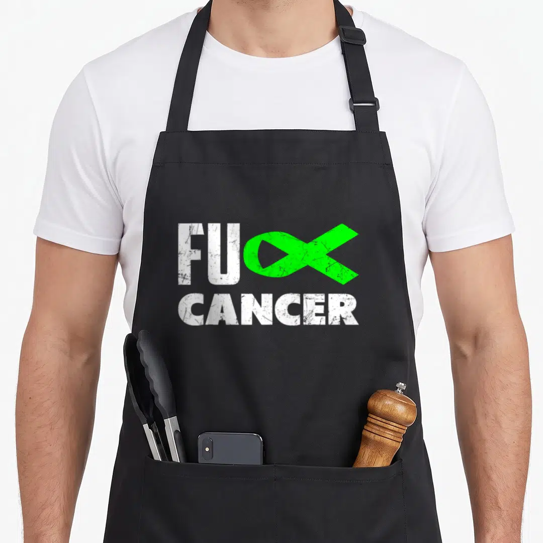 Cancer lime green apron - Distressed white text FU CANCER with green ribbon forming the letter K — shown on a black cotton canvas apron against a white background